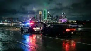 Police traffic stop on a Dallas Texas highway at night representing DWI and intoxication assault charges