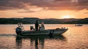 Texas game warden patrol boat on a lake at dusk representing boating while intoxicated BWI enforcement in Texas