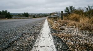 Painted white edge line on a Texas roadway shoulder where field sobriety tests are administered during a DWI stop