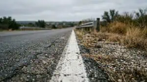 Painted white edge line on a Texas roadway shoulder where field sobriety tests are administered during a DWI stop